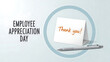 © rahul - Employee appreciation day thank you note with pen on light background