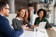 © Jelena - Team Collaboration in Modern Office Environment During a Creative Meeting