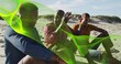 © vectorfusionart - Sitting three men chatting on sandy beach in casual clothes with denim jacket and neon-green mesh