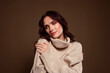 © Beauty Hero - Charming young woman posing gracefully in soft beige turtleneck sweater, styled in cozy autumn fashion