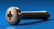 © aldino - A close-up of a metallic screw with a cross-shaped slot on a blue background