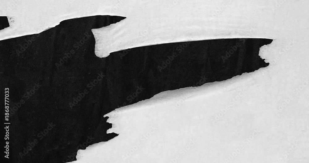 White ripped torn paper on black poster background creased crumpled backdrop surface, blank empty space for text