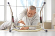 © Pixel-Shot - Senior man with walker lying on floor after fall at home