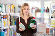© JackF - Focused young Woman choosing dishwashing liquid on big supermarket shelf