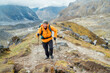 © Soloviova Liudmyla - Caucasian man with backpack and trekking poles climbs by Makalu Barun Park route near Khare. Mera peak climbing acclimatization active walk. Backpacker enjoying valley view. Active people concept.