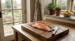 © Keluarga Berkah - Fresh salmon fillet on a wooden cutting board in a kitchen.
