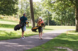 © Diego Martin/Stocksy - Senior Couple Walking Together on a Golf Course Path
