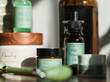 © Milles Team/Stocksy - Beauty Products Arranged on a Wooden Surface in Natural Light