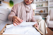 © Jovo Jovanovic/Stocksy - Muslim woman packing gift