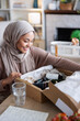 © Jovo Jovanovic/Stocksy - Small business owner happy to receive new product line