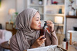 © Jovo Jovanovic/Stocksy - Customer smelling a bottle of lotion.