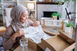 © Jovo Jovanovic/Stocksy - Content creator unboxing package for online video