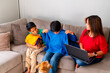 © Christine La/Stocksy - family shopping online together