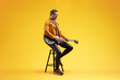 © Ljupco Smokovski - Guitar player sitting on a chair