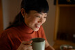 © Artcore Studio/Stocksy - Woman enjoying a warm drink