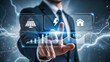 © Khanif - A professional in a suit engages with a holographic touch screen showing energy, solar, and home icons alongside charts, illustrating modern digital finance, smart energy, and tech-driven business.