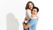© Fridocha - Happy Couple Embracing and Smiling.