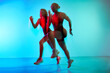 © Javier Díez/Stocksy - Dynamic movement of athletes in vibrant colors during workout se