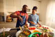 © Boris Jovanovic/Stocksy - Man and woman enjoy cooking together