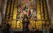 © Outsiderzone - Intricate altar with a statue and colorful artwork.. Orense Cathedral, Spain