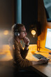 © Artcore Studio/Stocksy - Focused man working at a computer in a modern office space