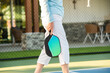 © Austockphoto - active healthy senior woman at pickleball
