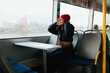 © Brat Co/Stocksy - Adjusting Beanie While Riding Ferry