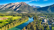 © jovannig - Panoramic aerial shot of Banff National Park with lush green valley in summer