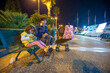 © jovannig - Seaside relaxation: Mother and daughter sitting on a bench along