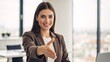 © Vasiliy - Smiling businesswoman extending hand for a handshake in modern office. Professional female manager welcoming a new employee or client. Hiring and partnership concept