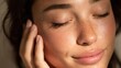 © LimeSky - A detailed image of a young woman with radiant skin softly caressing her face perfect for beauty and wellness promotions