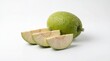 © Happy - Fresh green breadfruit and its raw slices showcasing its starchy interior on a white background
