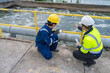 © reewungjunerr - Environmental engineers work at wastewater treatment plants,Water supply engineering working at Water recycling plant for reuse,Technicians and engineers discuss work together.