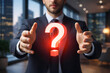 © WESLEY - Man with floating question mark in a work environment.