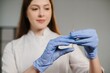 © dsheremeta - Nurse in gloves holding syringe preparing injection