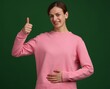 © New Africa - Woman with healthy stomach showing thumbs up on green background