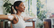 © peopleimages.com - Fitness, woman and yoga in home with stretching arms, breathwork exercise and meditation for wellness. Bokeh, zen person and breathing in house with pilates for mindfulness, inner peace and balance.