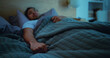 © BuyOutFelix06/peopleimages.com - Insomnia, thinking and man in bed at night for burnout, exhausted and fatigue for mental health. Blanket, home and person with thoughtful, anxiety and reflection for sleepless, bad dream and tired
