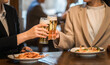 © buritora - Office lady/business woman drinking beer at restaurant, eatery, izakaya
