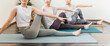 © buritora - Women doing yoga and pilates in a yoga studio or yoga class (sports gym)
