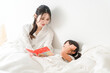 © buritora - Mother reading a picture book to her child in bed (putting to sleep, nap, reading aloud)