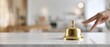 © Daryna - The Service Bell on a Marble Reception Counter with a Hand Reaching to Ring