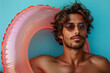© ink drop - Portrait of a man relaxing with a rubber swimming pool ring on summer vacation