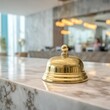 © setiadio - Golden service bell on marble counter interior
