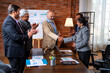 © StockImageFactory - Senior Indian Asian executives applauding and shaking hands after successful business presentation