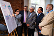 © StockImageFactory - Senior Indian executives analyzing growth presentation on board in modern office