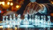 © Lani - A strategic move on a illuminated chessboard with a person's hand in focus, symbolizing strategic decision making and planning