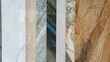 © Setyotuhu - Collection of marble and granite tile samples. Vertical luxury stone textures in white, grey, and brown. Ideal for interior design, flooring, and home renovation concepts.