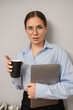 © svetograph - Businesswoman laptop coffee standing professional portrait corporate copy space