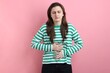 © New Africa - Woman suffering from stomach ache on pink background